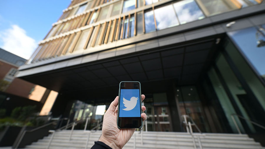 The Twitter emblem is displayed on a smart phone outside the Twitter offices in Dublin on November ...