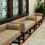 The interior glass patterns were inspired by quatrefoil motifs seen in Spanish colonial architecture. The same pattern is repeated in ordinance room fabrics using the colors blue, gold, opal white and green. (Intellectual Reserve, Inc.)
