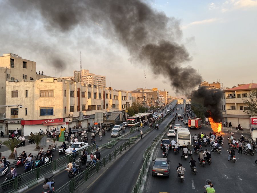 TOPSHOT - A picture obtained by AFP outside Iran, reportedly shows a motorcycle on fire in the capi...