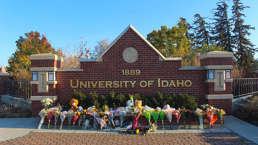 Flowers and stuffed animals are lined up outside the University of Idaho to pay tribute to four stu...