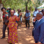 Community leaders walk to the location of the fruit tree handover event Dodoma Tanzania 16 Nov 2022. (Intellectual Reserve, Inc.)