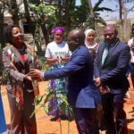Dar es Salaam District President Rubona hands over a guava seedling to Regional Commissioner Rosemary Senyamule at the fruit tree handover event in Dodoma Tanzania 16 Nov 2022. (Intellectual Reserve, Inc.)