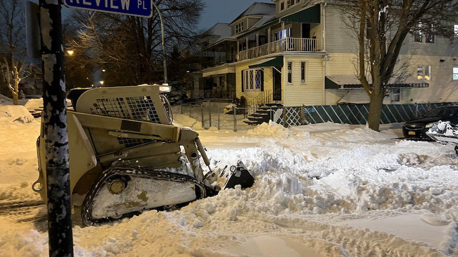 National guard members help clear roads in Buffalo, New York, following a winter storm. (New York N...