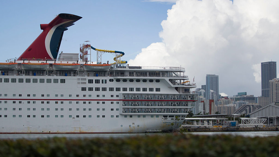 MIAMI, FLORIDA - MAY 02:  A Carnival Cruise ship is docked at the PortMiami as the company becomes ...