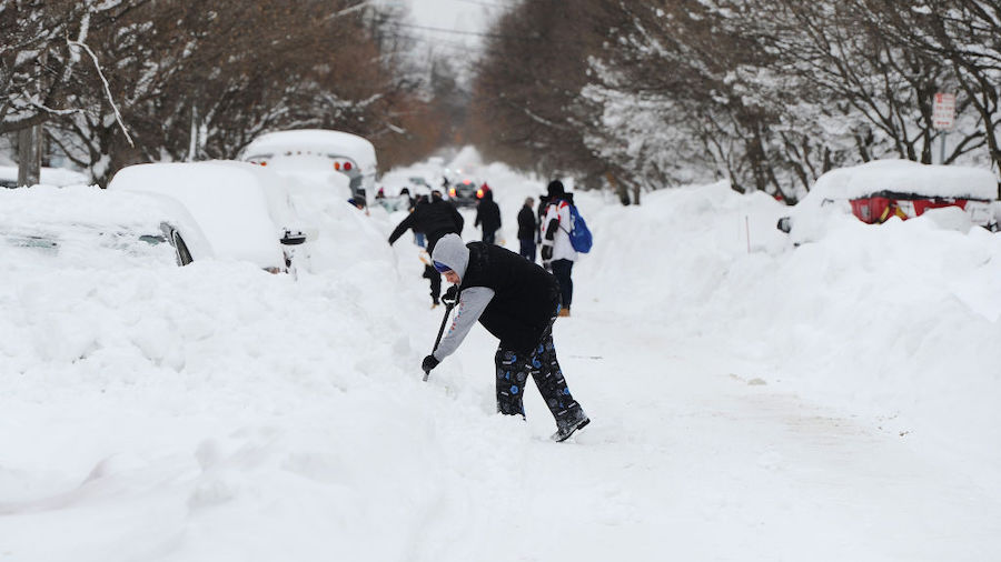 Residents on Woodside Drive take it upon themselves to clear heavy snow on December 27, 2022 in Buf...