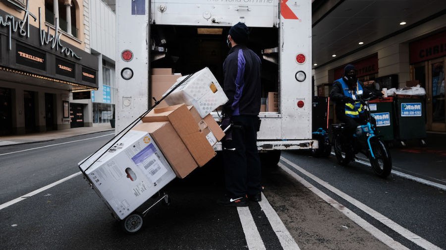 FILE: A FedEx truck makes deliveries on December 06, 2021 in New York City. As Americans continue t...