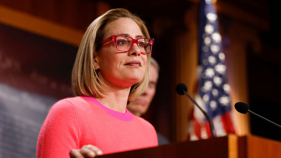 U.S. Sen. Kyrtsen Sinema (D-AZ) speaks at a news conference after the Senate passed the Respect for...
