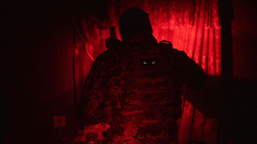 A military medic makes coffee during a power outage at a frontline field hospital on December 05, 2...