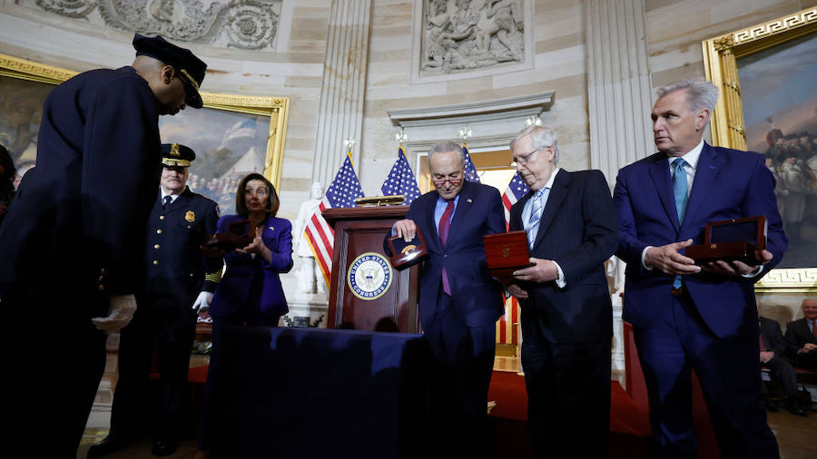 District of Columbia Police Chief Robert Contee looks on as House Speaker Nancy Pelosi (D-CA) passe...