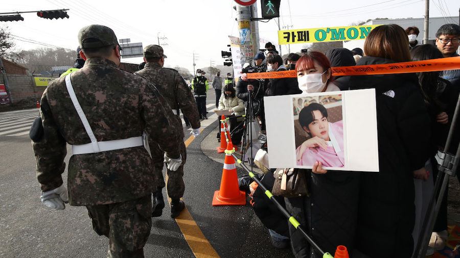 Fans wait to see BTS's Jin's join the military service in front of the 5th Infantry Division recrui...