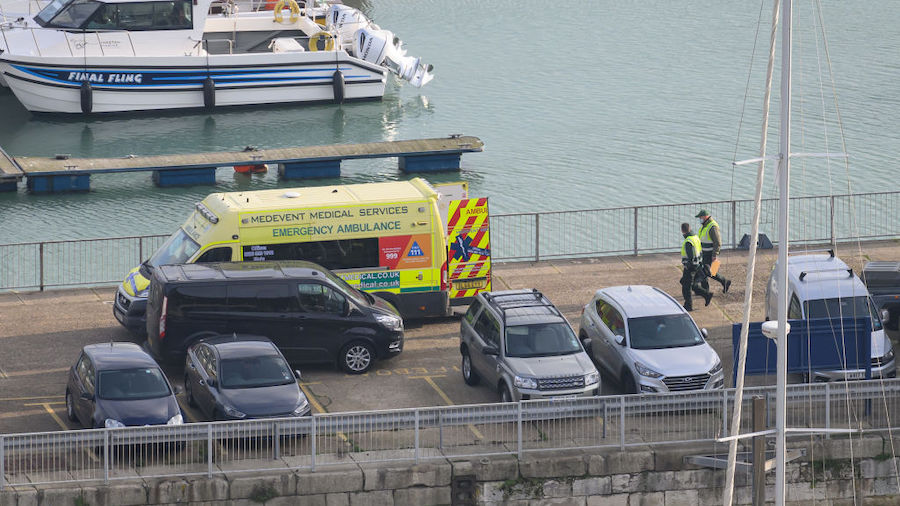 An ambulance crew walks towards their vehicle following a rescue mission in the English Channel on ...