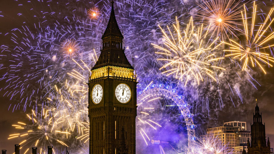 Fireworks light up the London skyline over Big Ben and the London Eye just after midnight on Januar...