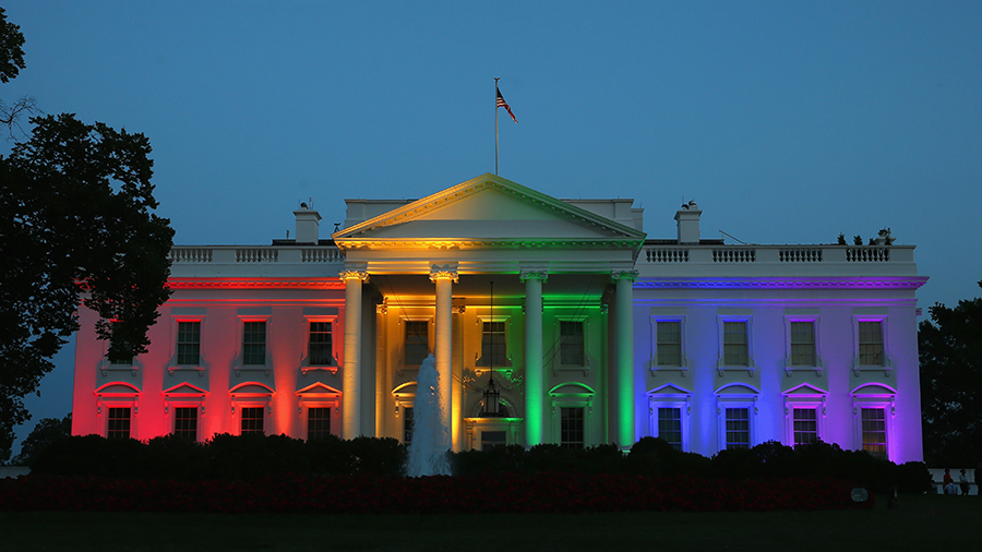 The White House is illuminated with rainbow colors....