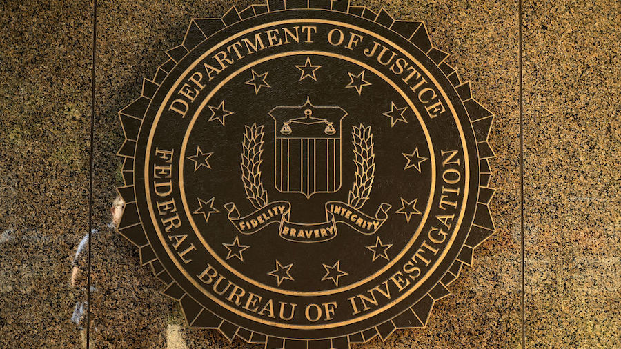 The seal of the Federal Bureau of Investigation hangs on the outside of the bureau's Edgar J. Hoove...