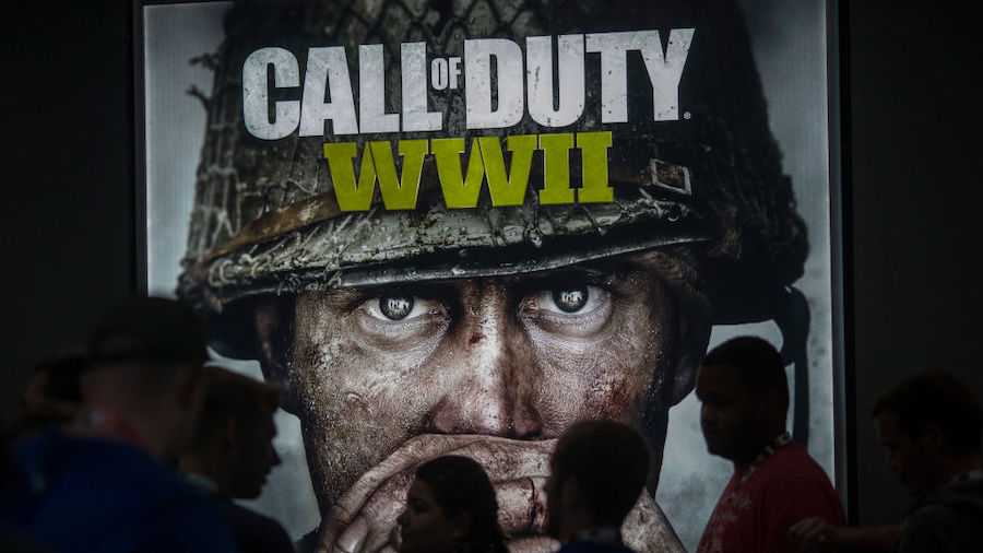 People wait in line of to see a demonstration Call of Duty WWII at the Activision exhibit on openin...