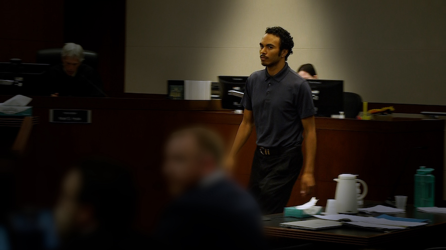 Joshua Homer stands in a court room...