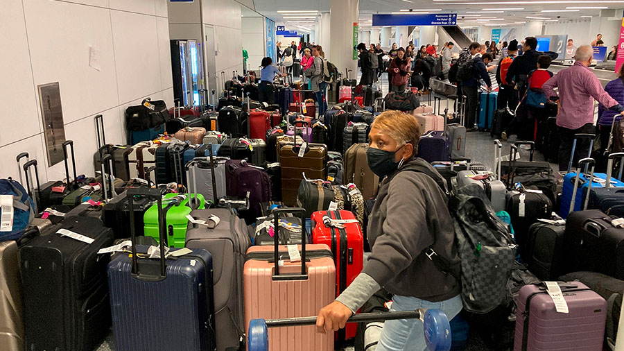 Baggage waits to be claimed after canceled flights at the Southwest Airlines terminal at Los Angele...