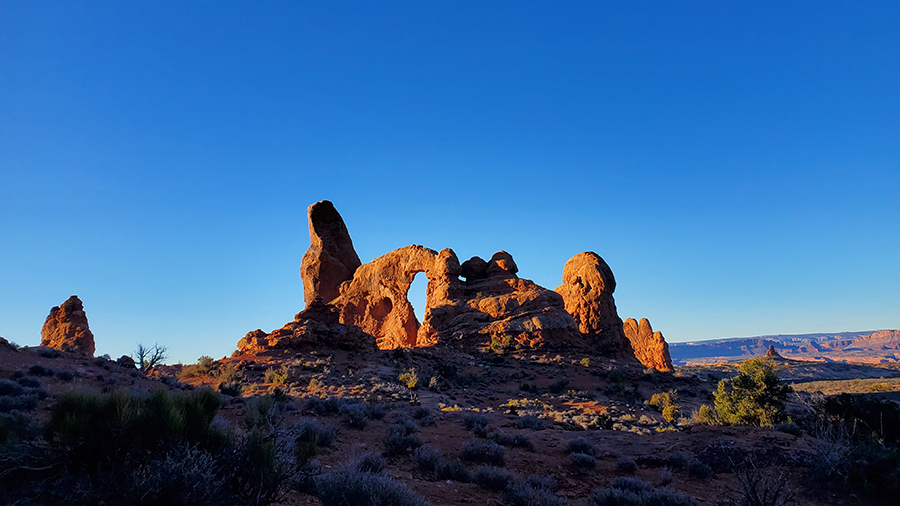 Rock formation with an arch in barren landscape...