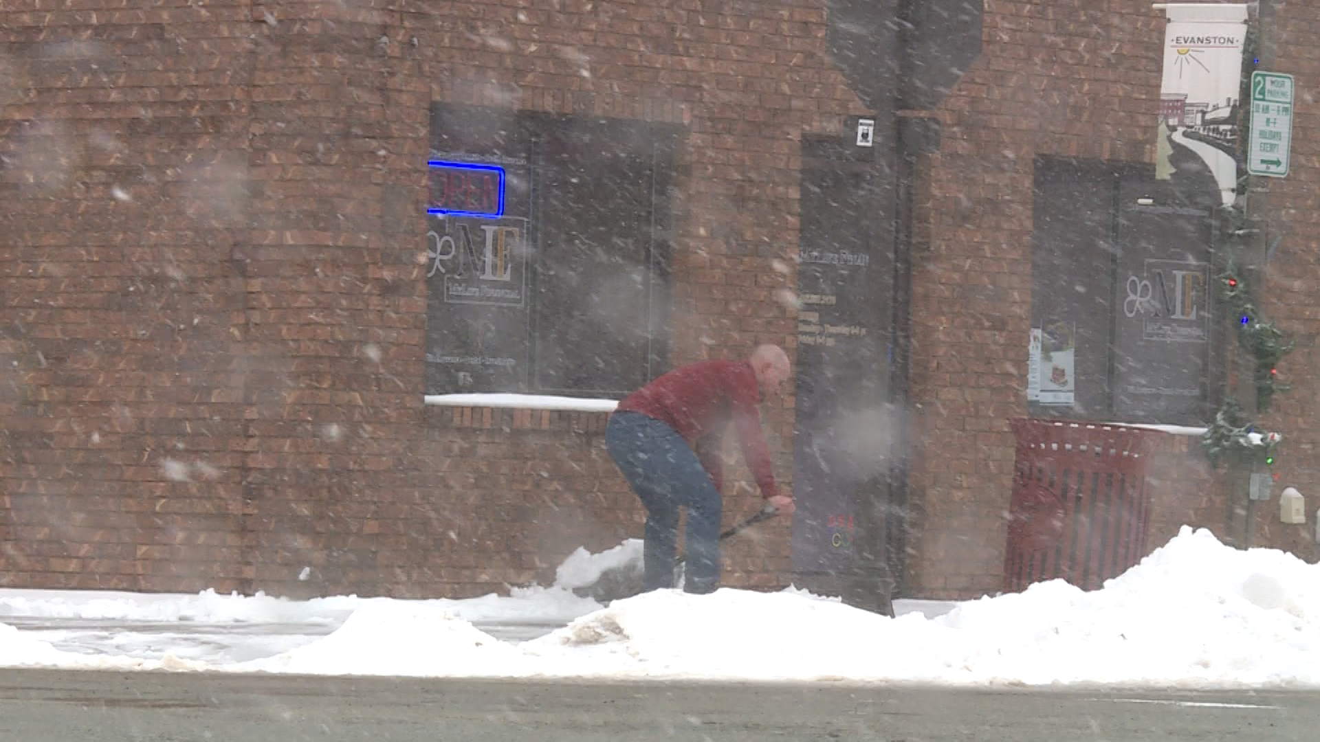 Jared Briggs shovels snow...