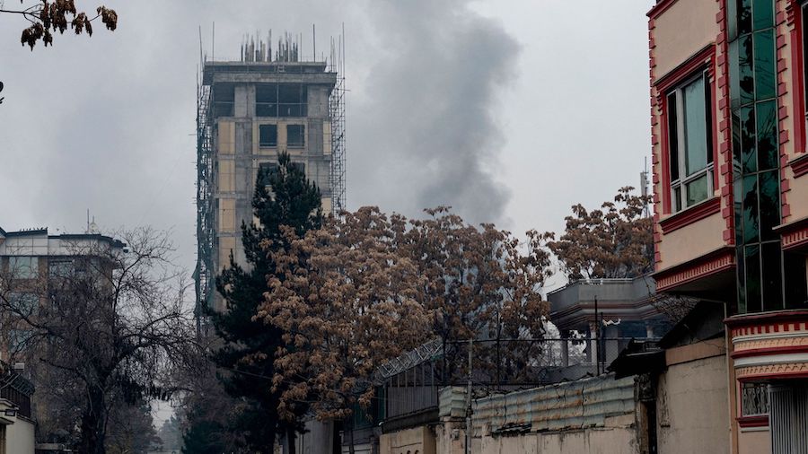 Smoke rises from the site of an attack in Shahr-e-naw, Kabul, Afghanistan, on Dec. 12. (Wakil Kohsa...