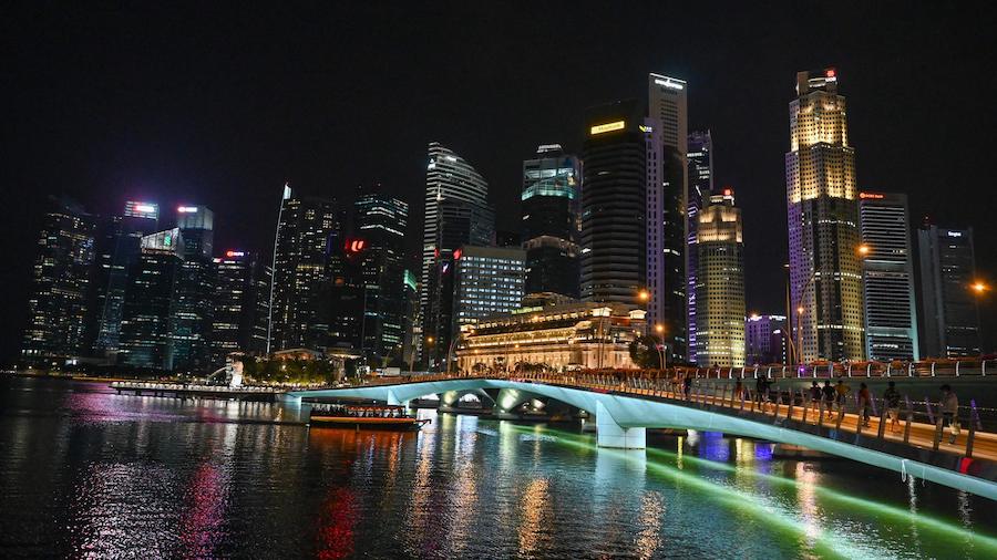 A general view of the city skyline is seen with the lights switched on just before the Earth Hour e...