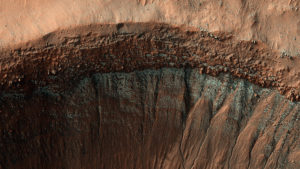 red sand crater with hints of blue