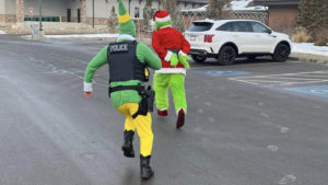 a police officer chasing the grinch