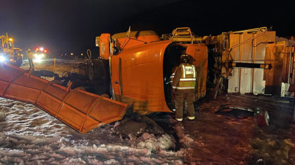 yellow snowplow vehicle on its side