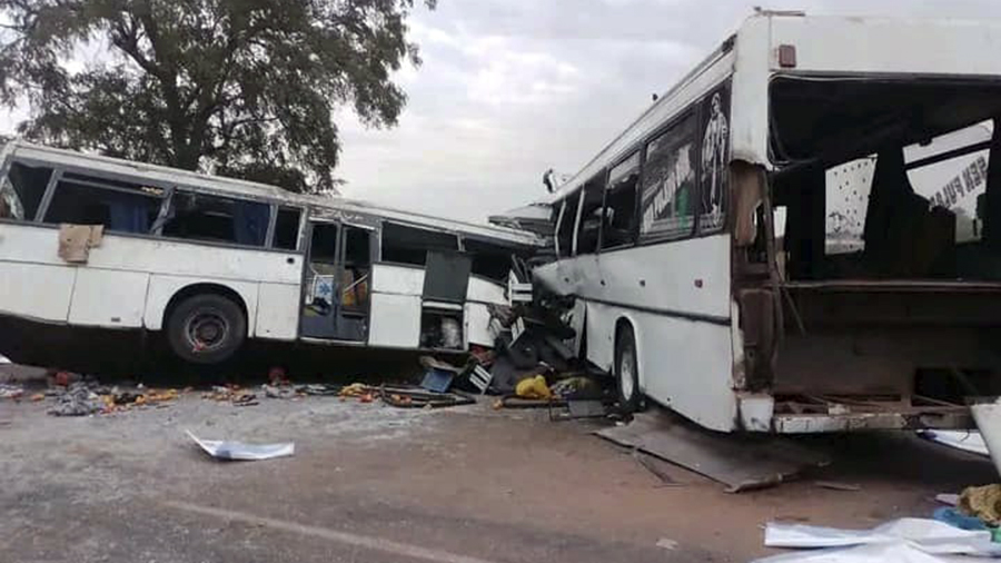 Two damaged buses are pictured after they collided on a road in Gniby, Senegal, Sunday Jan. 8, 2023...