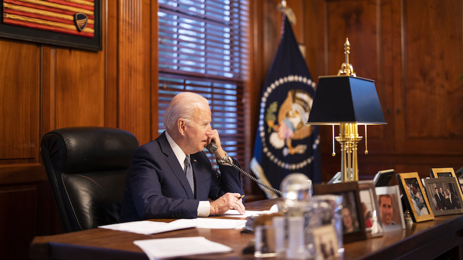 FILE - In this file image provided by The White House, President Joe Biden speaks with Russian Pres...