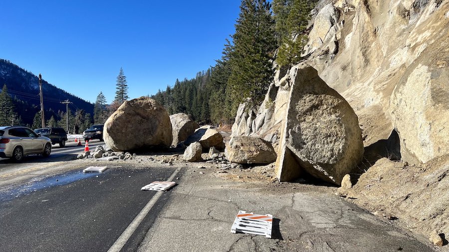 In this photo provided by Caltrans District 3, several large boulders lie in the street that fell o...