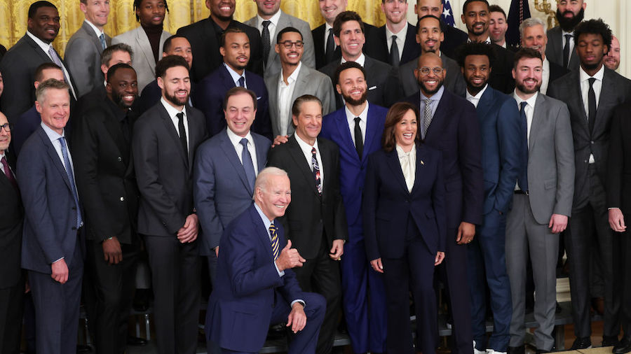 U.S. President Joe Biden poses for a photo with the Golden State Warriors during a ceremony honorin...