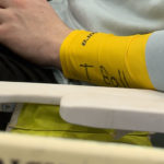 The yellow armbands worn by the boy runners on the team. (KSL-TV's Ray Boone)