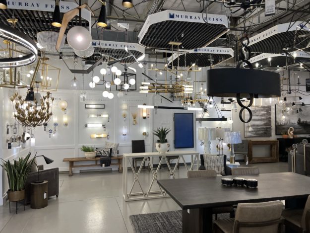 lighting design showroom featuring various lighting fixtures against a white wall