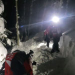 Search and Rescue crews helping the two snowmobilers. (Wasatch County Search & Rescue)
