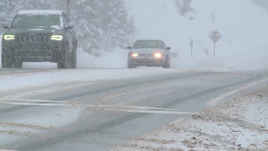 Cars driving through a snowstorm. (KSLTV)...