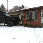 SWAT units preparing to breach the home. (KSL-TV)