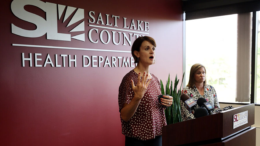 Dr. Angela Dunn, executive director of Salt Lake County Health Department, left, discusses schoolch...