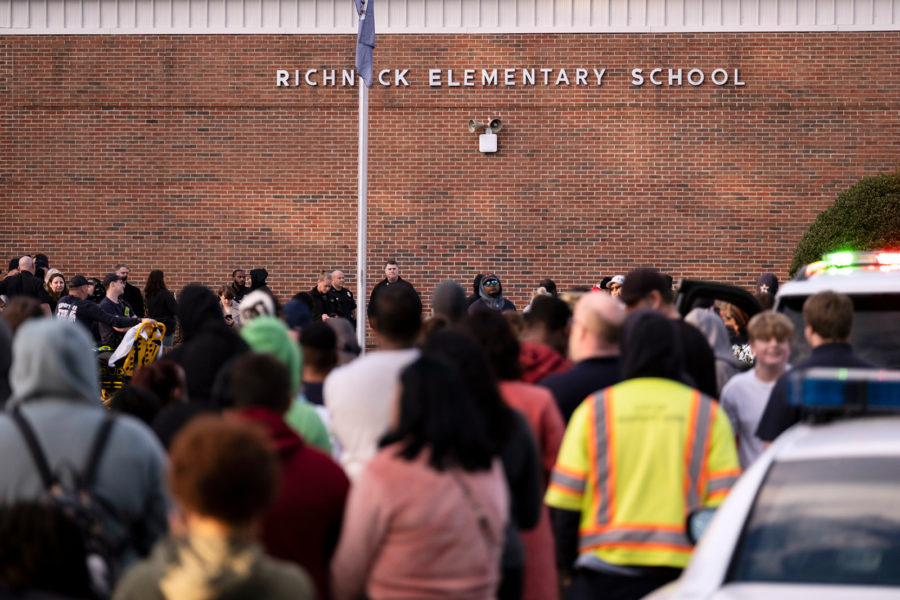 Students and police gather outside of Richneck Elementary School after a shooting, Friday, Jan. 6, ...