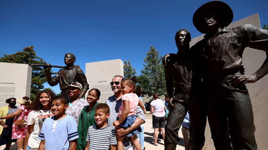 The Sweeney family from West Valley City poses for photos at the Black Pioneer Monument at This Is ...