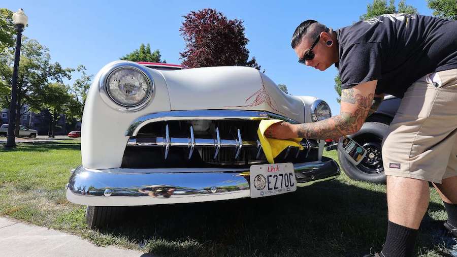 Nick Lobos cleans his 1950 Ford during the Rumble in the Park car show in Salt Lake City on June 13...