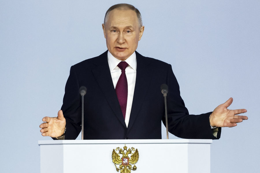 Russian President Vladimir Putin gestures as he gives his annual state of the nation address in Mos...