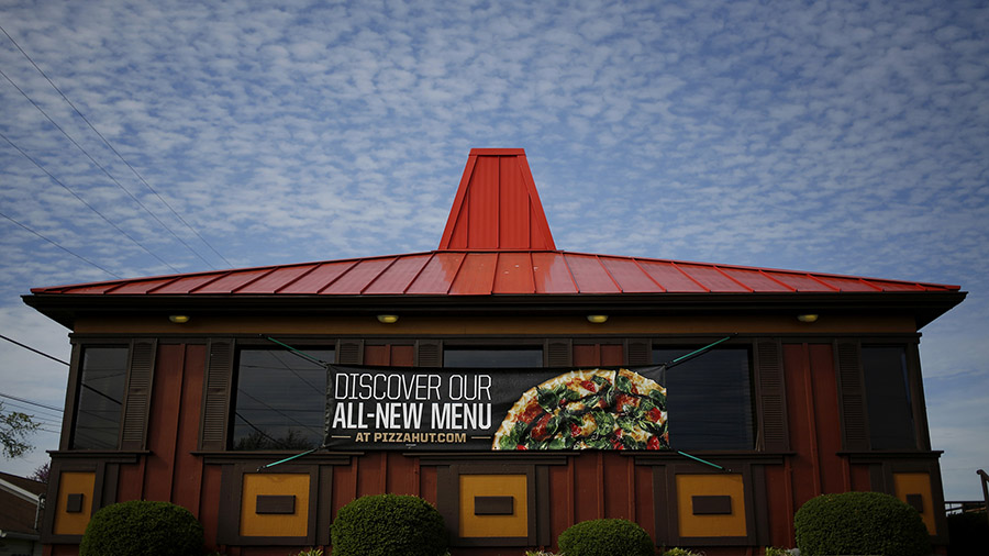 Pizza Hut's red-roof restaurants have come down, replaced by sleek new designs. (Luke Sharrett/Bloo...