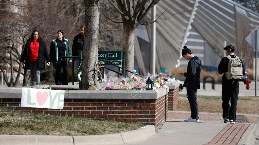 Michigan State University students visit a memorial at Berkey Hall on the day they return to classe...