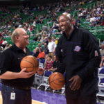 Jazz owner Larry Miller and Karl Malone talk prior to the opening Jazz game of the season, Tuesday Oct. 30, 2001. (Tom Smart/Deseret News)