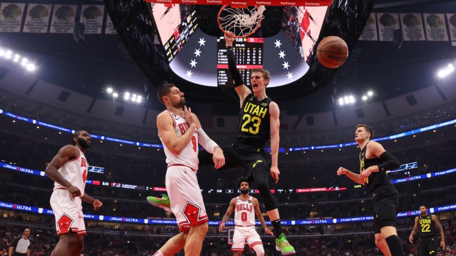 Lauri Markkanen #23 of the Utah Jazz celebrates a dunk against the Chicago Bulls during the second ...
