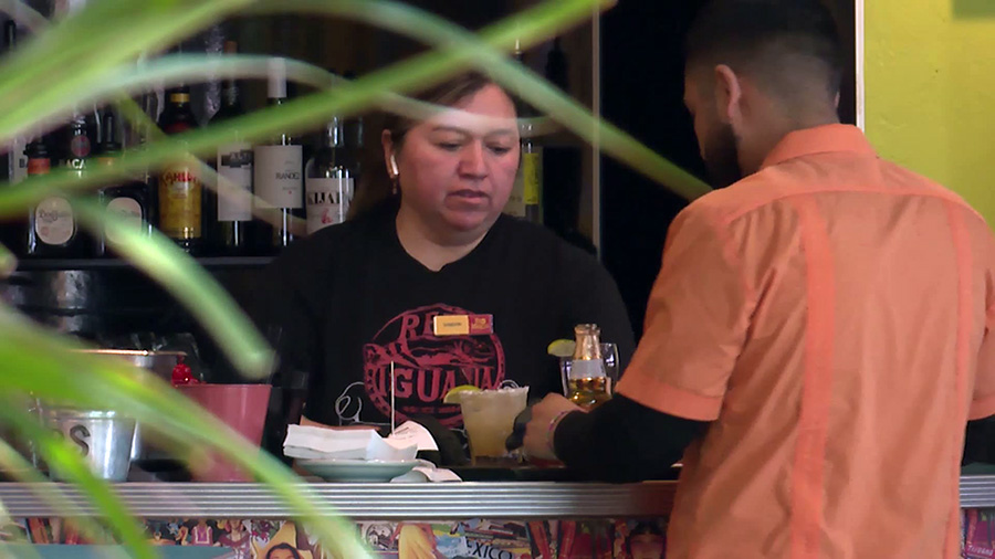 Customers and employees at the Red Iguana restaurant. (KSLTV)...