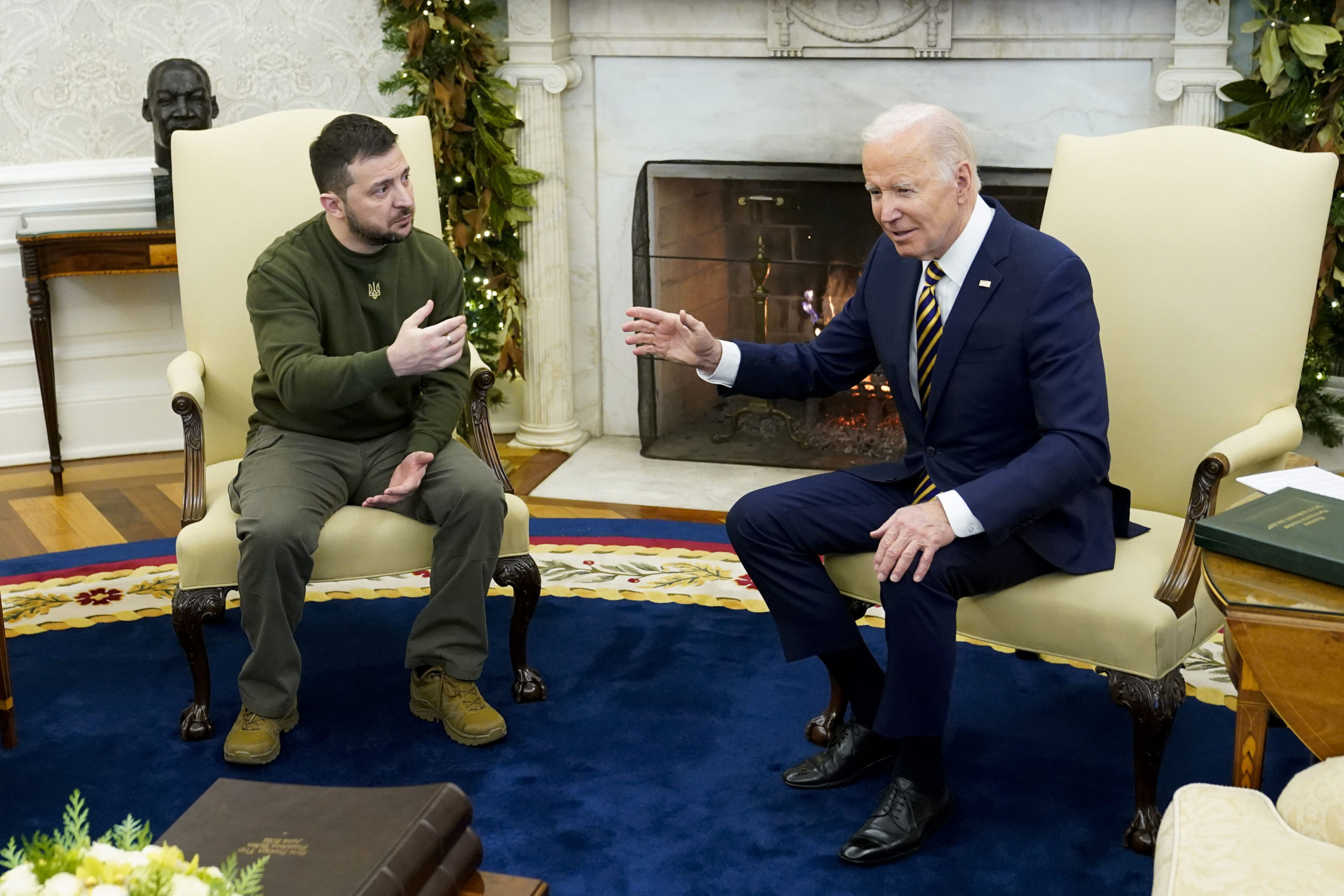 FILE - President Joe Biden speaks with Ukrainian President Volodymyr Zelenskyy as they meet in the ...