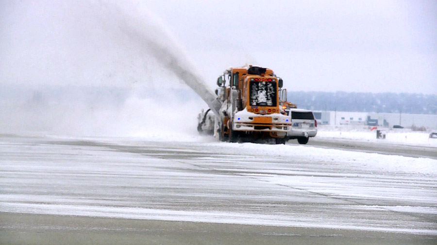 Crews clearing off the runway. (KSLTV/Mark Less)...