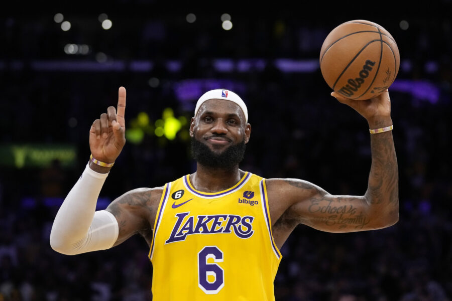 Los Angeles Lakers forward LeBron James gestures after passing Kareem Abdul-Jabbar to become the NB...